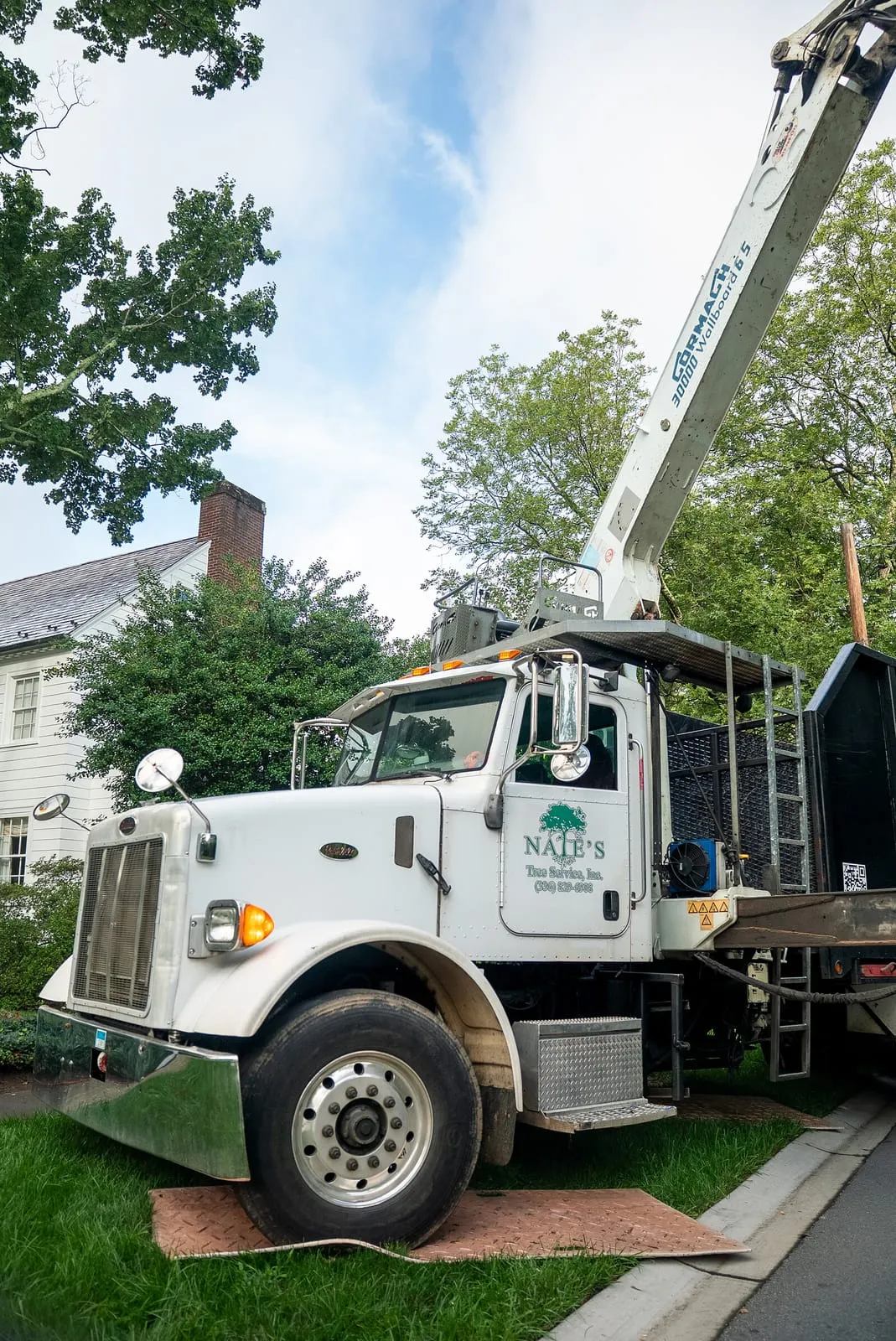 Nate's Tree Service truck arriving at a residential job